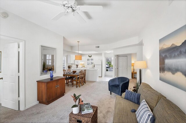 8335 Glenrose Way Unit 1513, Sarasota, FL 34238 - living room featuring light colored carpet and a ceiling fan