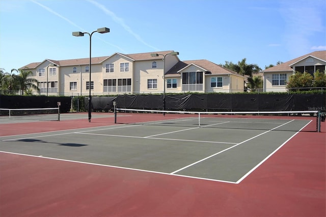 8335 Glenrose Way Unit 1513, Sarasota, FL 34238 - view of tennis court featuring community basketball court and a residential view