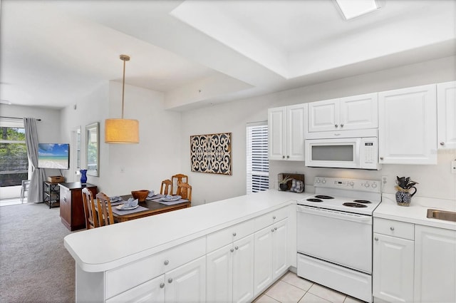8335 Glenrose Way Unit 1513, Sarasota, FL 34238 - kitchen featuring white appliances, a peninsula, light countertops, and white cabinets