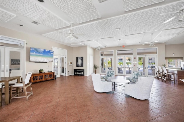 8335 Glenrose Way Unit 1513, Sarasota, FL 34238 - tiled living area featuring ceiling fan and french doors