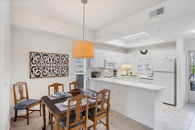 8335 Glenrose Way Unit 1513, Sarasota, FL 34238 - dining space with a raised ceiling and light tile patterned floors