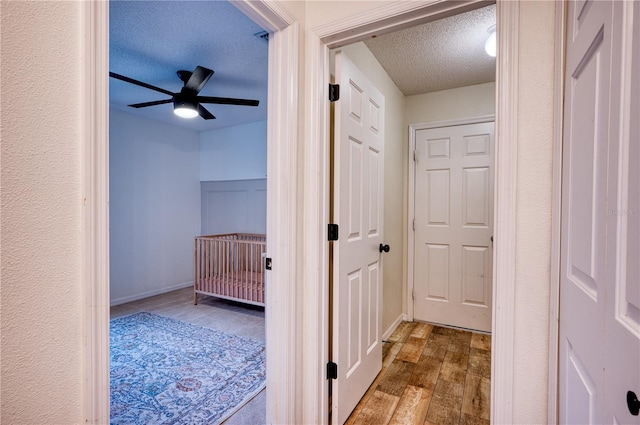 4204 Malickson Dr, Parrish, FL 34219 - hall featuring a textured ceiling and wood finished floors