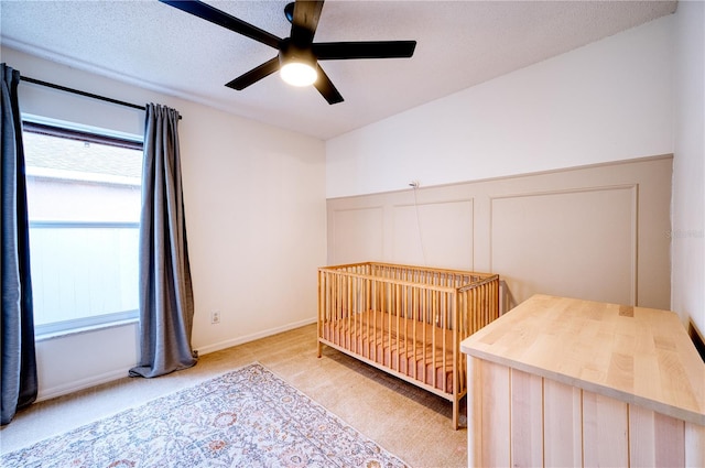 4204 Malickson Dr, Parrish, FL 34219 - bedroom with light colored carpet, a decorative wall, a ceiling fan, and a wainscoted wall