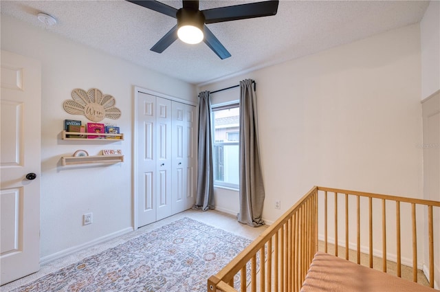 4204 Malickson Dr, Parrish, FL 34219 - carpeted bedroom featuring a closet, a textured ceiling, and ceiling fan