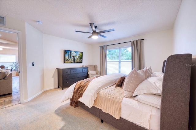 4204 Malickson Dr, Parrish, FL 34219 - bedroom with light carpet, a ceiling fan, and a textured ceiling