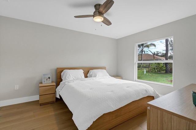 2703 Carmelia St, North Port, FL 34288 - bedroom featuring light wood-style flooring and a ceiling fan