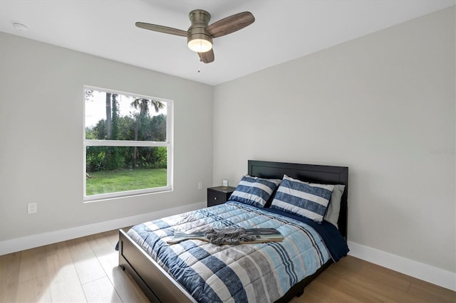 2703 Carmelia St, North Port, FL 34288 - bedroom featuring wood finished floors and ceiling fan