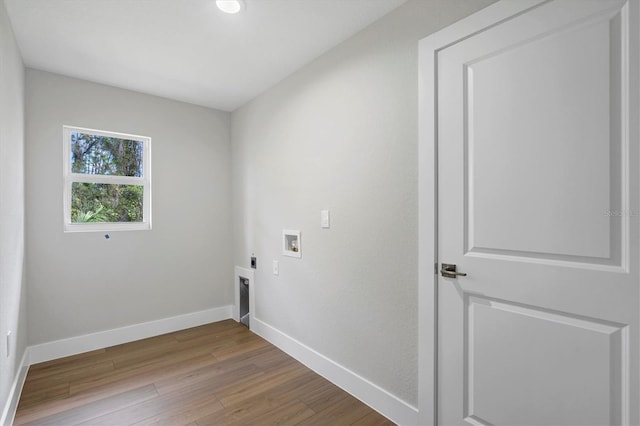 2703 Carmelia St, North Port, FL 34288 - laundry room featuring hookup for an electric dryer, wood finished floors, and washer hookup