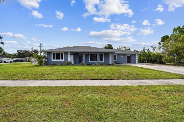 303 45th St W, Bradenton, FL 34209 - ranch-style home with a front yard, stucco siding, and driveway
