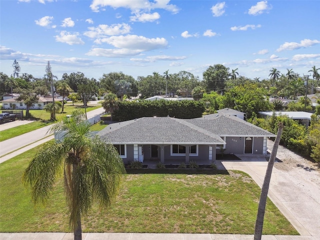 303 45th St W, Bradenton, FL 34209 - ranch-style home featuring driveway and a front yard