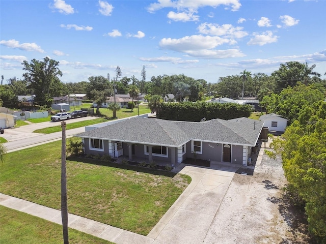 303 45th St W, Bradenton, FL 34209 - view of front of property with driveway, a front lawn, and a residential view