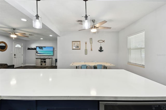 303 45th St W, Bradenton, FL 34209 - kitchen with a ceiling fan, recessed lighting, open floor plan, light countertops, and pendant lighting