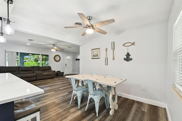 303 45th St W, Bradenton, FL 34209 - dining area with a ceiling fan and dark wood-type flooring