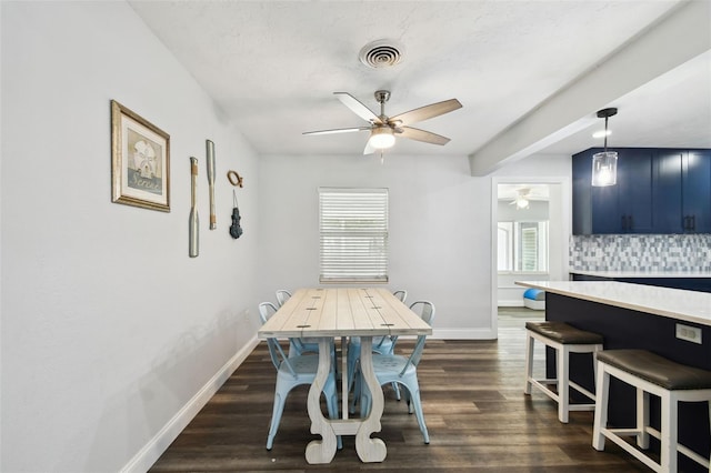 303 45th St W, Bradenton, FL 34209 - dining area featuring a ceiling fan and dark wood finished floors