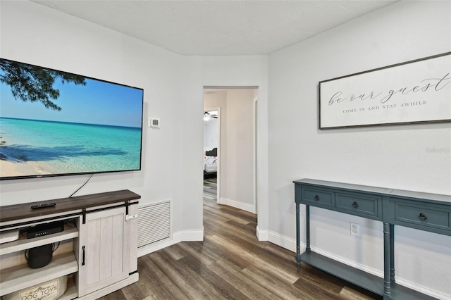 303 45th St W, Bradenton, FL 34209 - hallway with dark wood-style floors and baseboards
