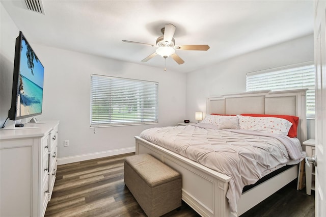 303 45th St W, Bradenton, FL 34209 - bedroom with dark wood-style flooring and a ceiling fan
