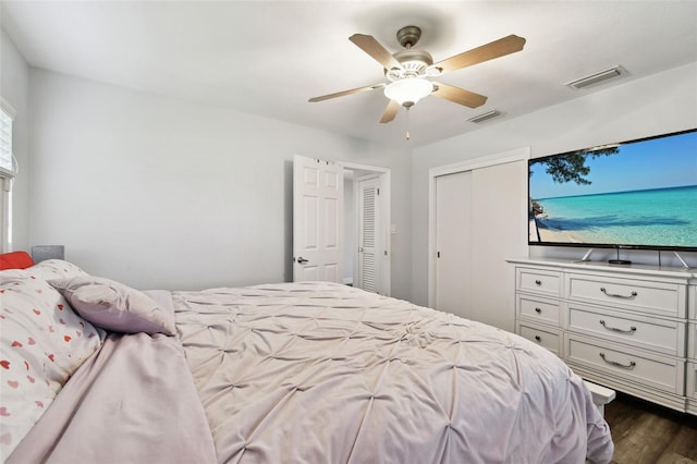 303 45th St W, Bradenton, FL 34209 - bedroom with dark wood-style flooring, a closet, and ceiling fan