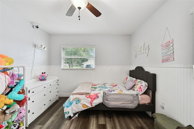 303 45th St W, Bradenton, FL 34209 - bedroom featuring wainscoting, dark wood-type flooring, and a ceiling fan