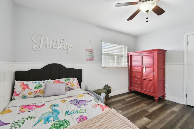 303 45th St W, Bradenton, FL 34209 - bedroom with dark wood-style floors, wainscoting, and ceiling fan