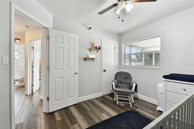 303 45th St W, Bradenton, FL 34209 - bedroom featuring wood finished floors, a textured wall, and a ceiling fan
