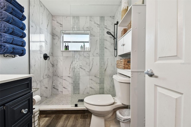 303 45th St W, Bradenton, FL 34209 - full bathroom with a marble finish shower, vanity, and wood finished floors