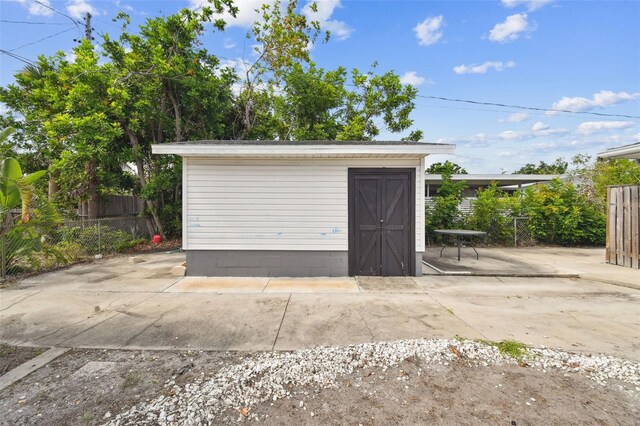 303 45th St W, Bradenton, FL 34209 - garage featuring a storage shed