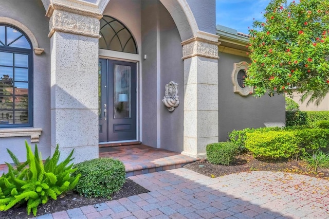 13818 Milan Ter, Lakewood Ranch, FL 34202 - view of exterior entry featuring stucco siding