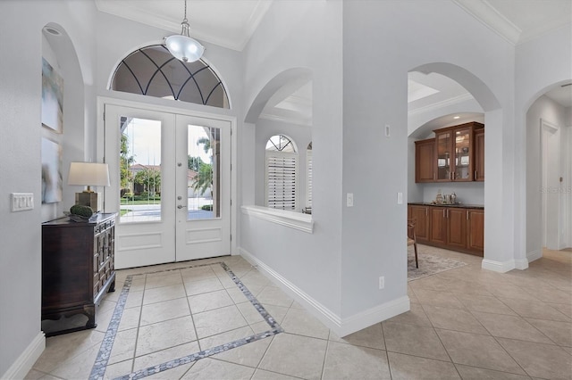 13818 Milan Ter, Lakewood Ranch, FL 34202 - entryway featuring crown molding, french doors, and a high ceiling