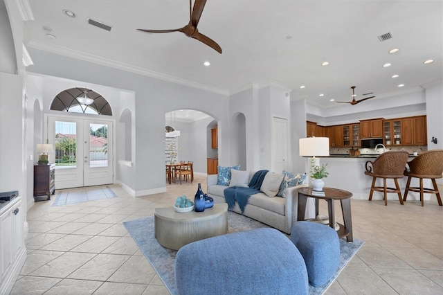 13818 Milan Ter, Lakewood Ranch, FL 34202 - living area with ceiling fan, arched walkways, crown molding, and recessed lighting