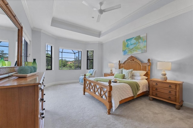 13818 Milan Ter, Lakewood Ranch, FL 34202 - bedroom featuring light carpet, a raised ceiling, ornamental molding, and ceiling fan