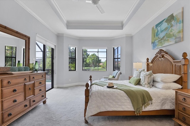 13818 Milan Ter, Lakewood Ranch, FL 34202 - bedroom with light carpet, access to outside, a tray ceiling, ornamental molding, and a ceiling fan
