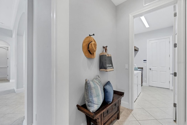 13818 Milan Ter, Lakewood Ranch, FL 34202 - hall featuring light tile patterned floors and arched walkways