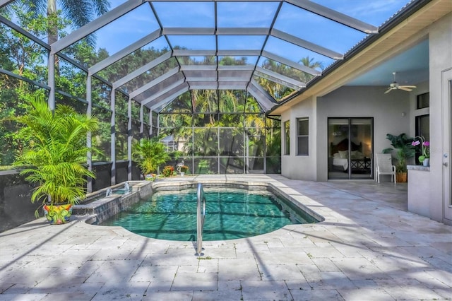 13818 Milan Ter, Lakewood Ranch, FL 34202 - view of swimming pool featuring a patio, a ceiling fan, a pool with connected hot tub, and glass enclosure