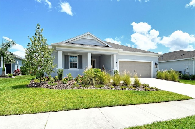 14312 Skipping Stone Loop, Parrish, FL 34219 - view of front of home featuring a garage, driveway, and a front lawn