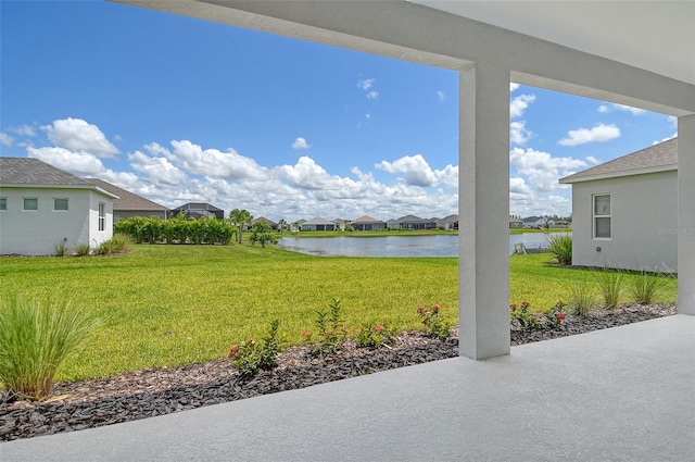 14312 Skipping Stone Loop, Parrish, FL 34219 - view of green lawn featuring a water view, a residential view, and a patio area