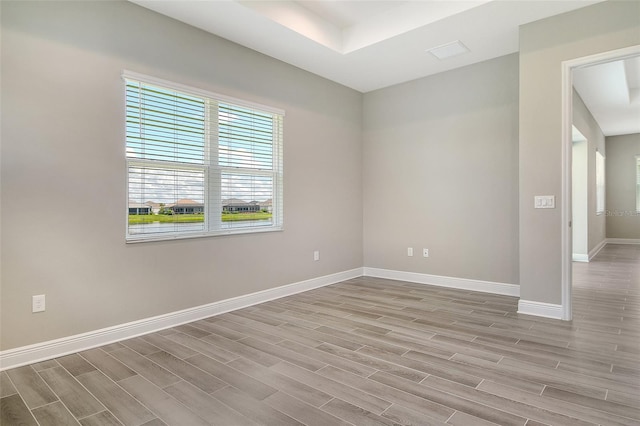 14312 Skipping Stone Loop, Parrish, FL 34219 - spare room featuring wood finished floors and baseboards