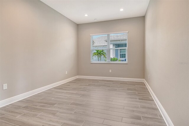 14312 Skipping Stone Loop, Parrish, FL 34219 - unfurnished room featuring light wood-type flooring and recessed lighting