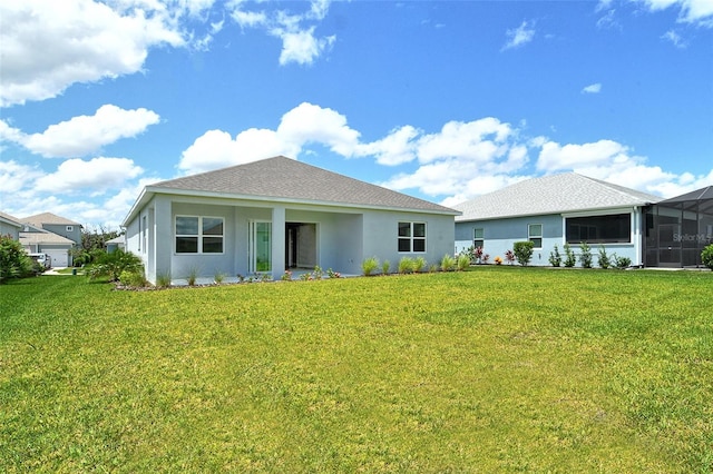 14312 Skipping Stone Loop, Parrish, FL 34219 - back of house with a yard and stucco siding