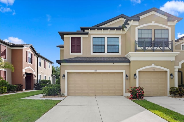 5174 78th St Cir E, Bradenton, FL 34203 - multi unit property featuring stucco siding, a balcony, a garage, and concrete driveway