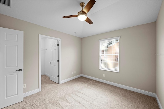 5174 78th St Cir E, Bradenton, FL 34203 - unfurnished bedroom with carpet, a spacious closet, a closet, and ceiling fan