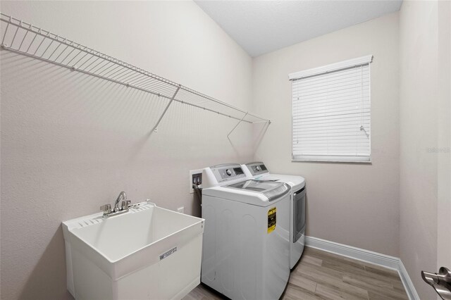 5174 78th St Cir E, Bradenton, FL 34203 - laundry area with washer and dryer and light wood-type flooring