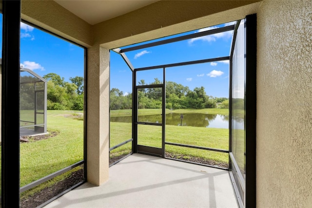 5174 78th St Cir E, Bradenton, FL 34203 - unfurnished sunroom with a water view, view of scattered trees, and plenty of natural light