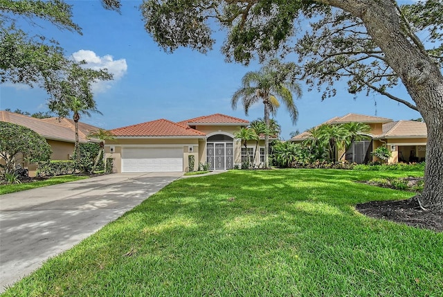 7868 Chick Evans Pl, Sarasota, FL 34240 - mediterranean / spanish house featuring stucco siding, an attached garage, a front lawn, a tiled roof, and concrete driveway