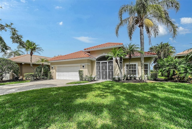 7868 Chick Evans Pl, Sarasota, FL 34240 - mediterranean / spanish-style home featuring a tiled roof, stucco siding, a garage, driveway, and a front lawn