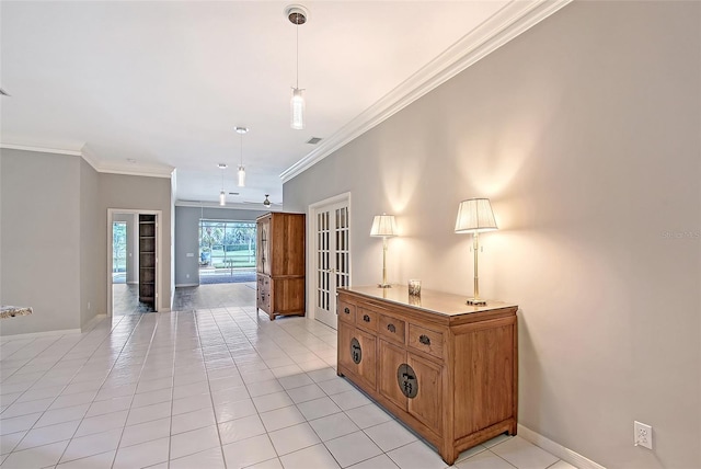 7868 Chick Evans Pl, Sarasota, FL 34240 - empty room with french doors, ornamental molding, and light tile patterned floors