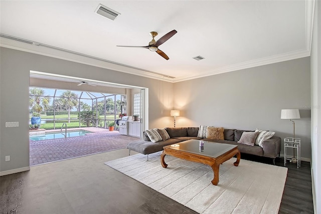 7868 Chick Evans Pl, Sarasota, FL 34240 - living room featuring a sunroom, a ceiling fan, ornamental molding, and wood finished floors