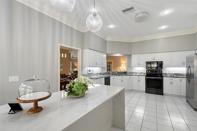 7868 Chick Evans Pl, Sarasota, FL 34240 - kitchen with black appliances, ornamental molding, light stone countertops, white cabinets, and light tile patterned floors