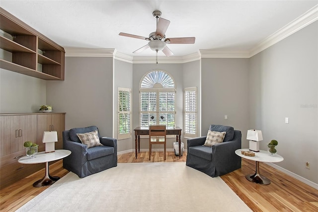 7868 Chick Evans Pl, Sarasota, FL 34240 - sitting room featuring wood finished floors, crown molding, and a ceiling fan