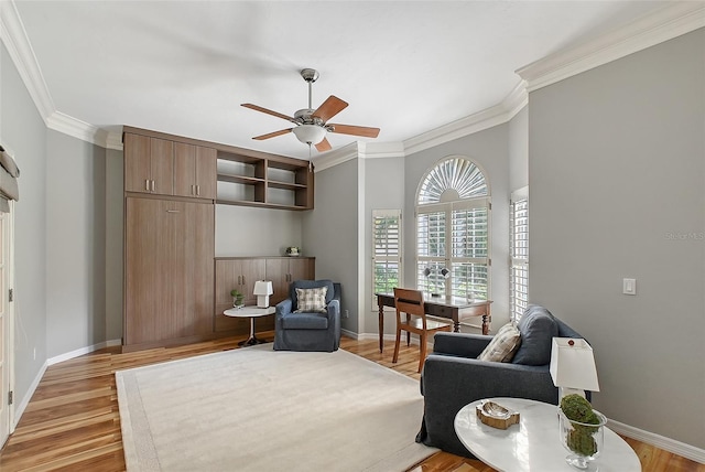 7868 Chick Evans Pl, Sarasota, FL 34240 - sitting room featuring ornamental molding, a ceiling fan, and light wood-style floors