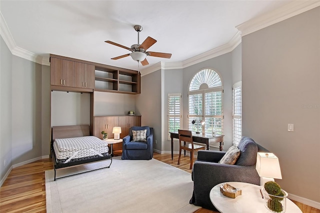 7868 Chick Evans Pl, Sarasota, FL 34240 - living room with ornamental molding, a ceiling fan, and light wood-type flooring